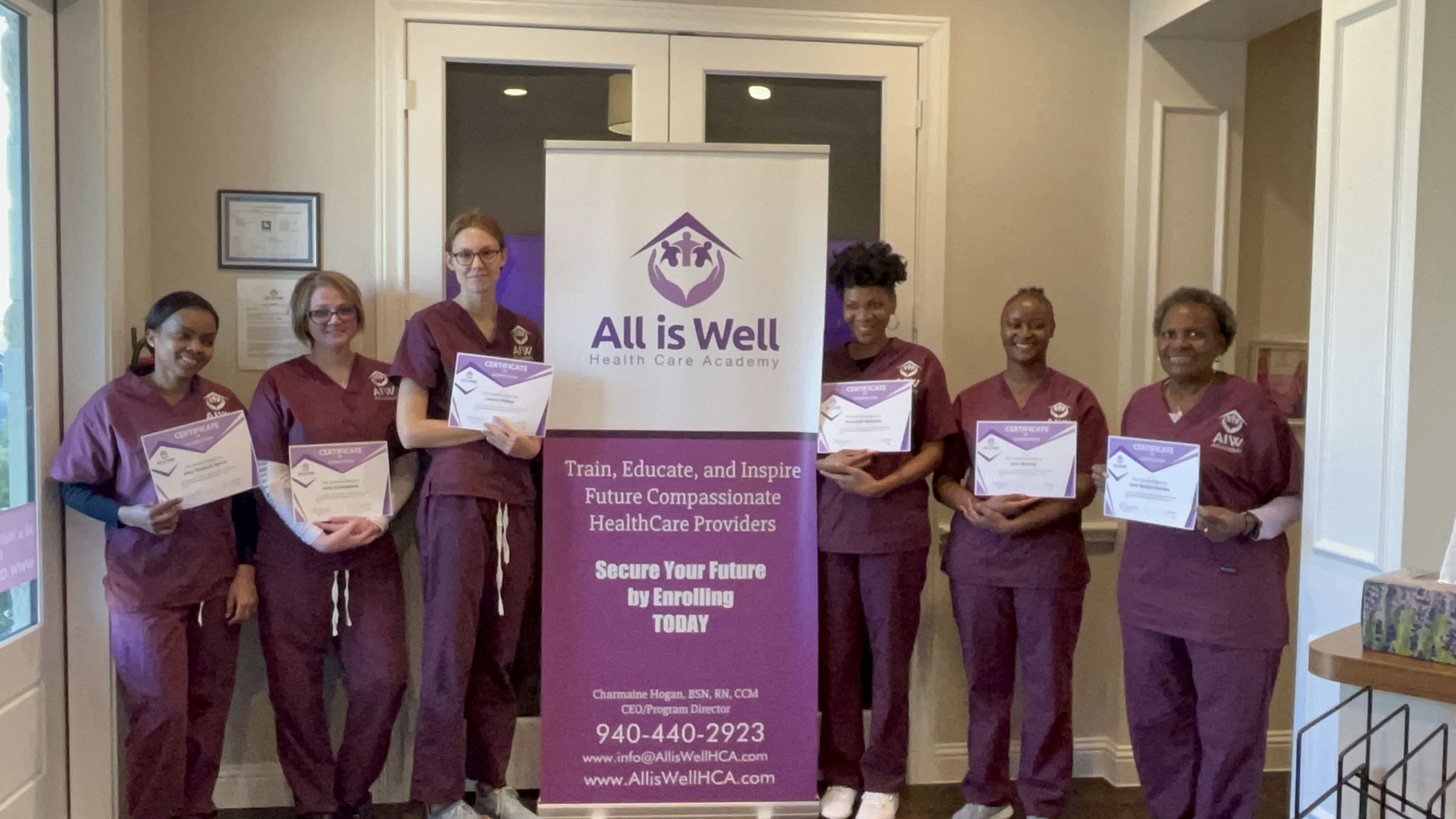 All is Well CNA graduates holding certificates