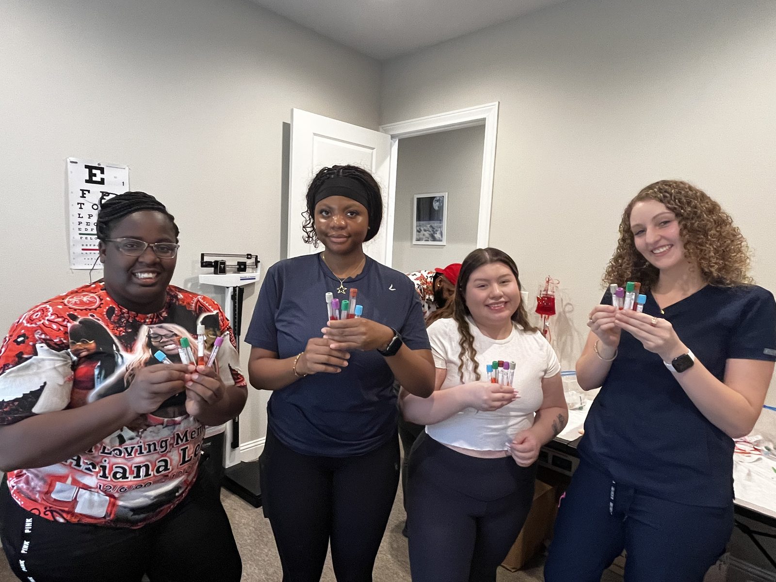 Phlebotomy class practising with collection tubes